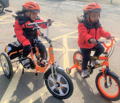 Romain and Roman out on their trikes